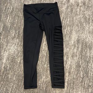 Black crop leggings with slits on the sides